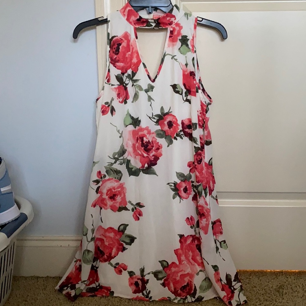 boutique floral dress with cutouts in front & back